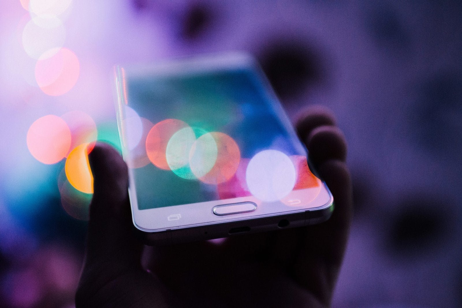 The Evolution of Digital Payments: From Cash to Cryptocurrencies 2 person holding smartphone