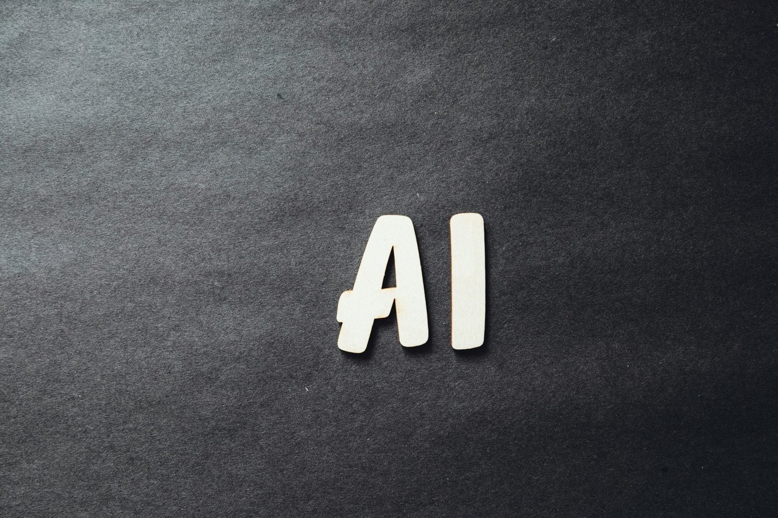 The Role of AI in Climate Change Mitigation: Applications, Impact, and Future Prospects 2 the word ai spelled in white letters on a black surface