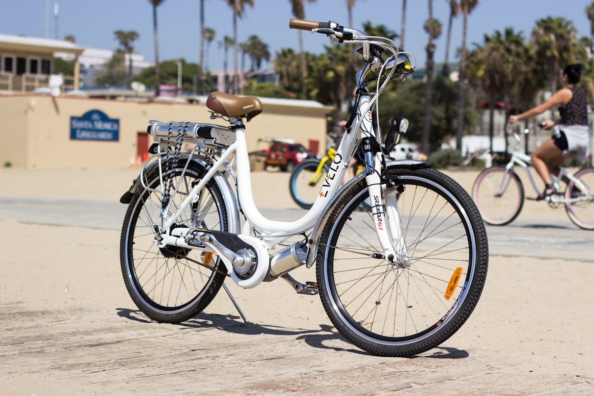 The Future of Transportation: Innovations in Mobility 4 A white electric bike is parked on the beach
